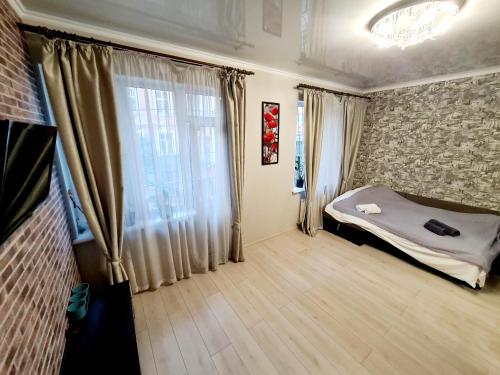 A bed or beds in a room at Center of Odessa. Comfortable 2 rooms apartment