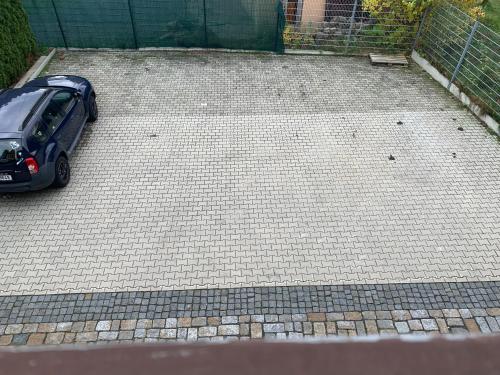 a car is parked in a parking lot at Penzion u Laštůvků in Šluknov