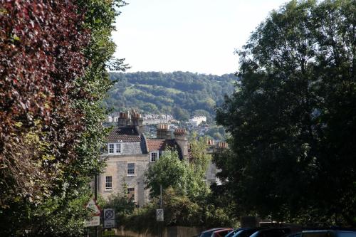 a house that has a bunch of trees on top of it at Lansdown Grove Hotel in Bath