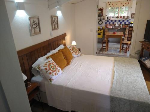 Loft do Alto-Araras 객실 침대