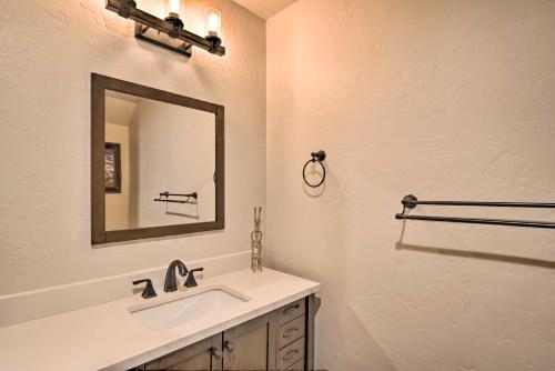 a bathroom with a sink and a mirror at Cozy Blue River Cabin with Treehouse 6 Mi to Skiing in Blue River