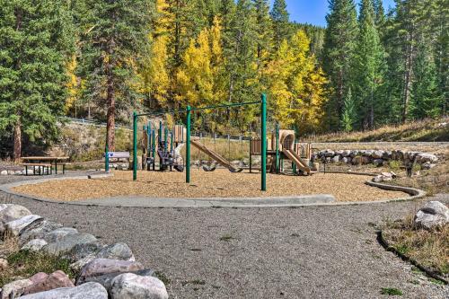 a park with a playground with a swing set at Cozy Blue River Cabin with Treehouse 6 Mi to Skiing in Blue River
