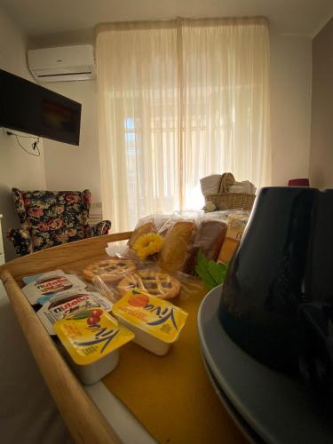 a living room with a table with food on it at A Casa dei Bruno B&B in Pozzuoli