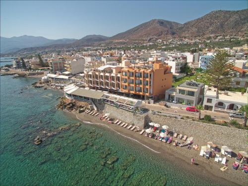 an aerial view of a beach with a resort at Palmera Beach Hotel & Spa - Adults Only in Hersonissos