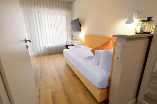 Postel nebo postele na pokoji v ubytování Hotel Seeliebe