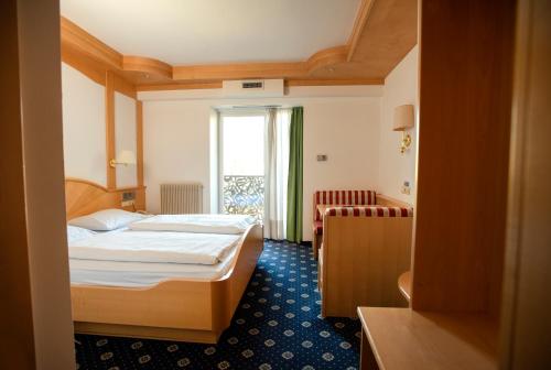 Säng eller sängar i ett rum på Hotel Chrys