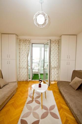 a living room with a couch and a table at Apartment Terassa in Bar