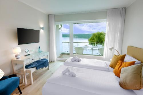 Postel nebo postele na pokoji v ubytování Hotel Seeliebe
