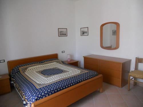Кровать или кровати в номере La Balestra 2 - appartamento panoramico