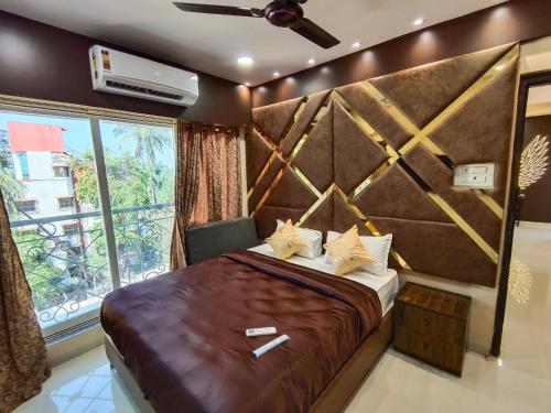 OSI Apartments Bandra West tesisinde bir odada yatak veya yataklar