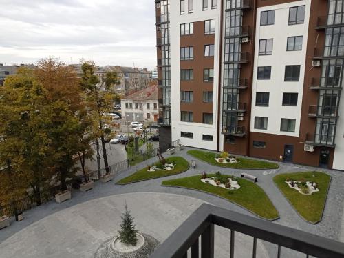 a view from the balcony of a building with a courtyard at Дуже файна квартира в самому центрі!!!!Переконайся!! in Rivne