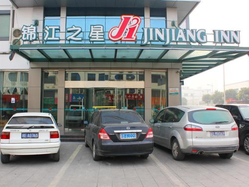 three cars parked in front of a building at Jinjiang Inn - Suzhou Wuzhong Baodai West Road in Suzhou