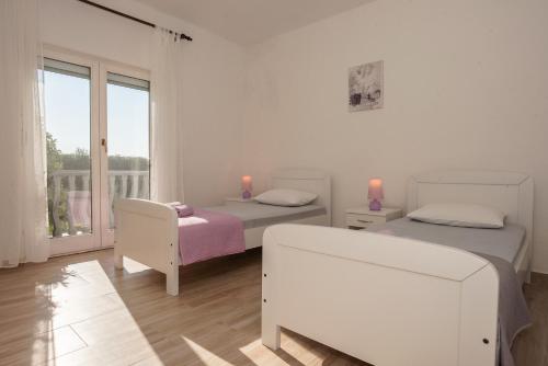 Postel nebo postele na pokoji v ubytování Holiday House San Mario - Pets Friendly Rural Home