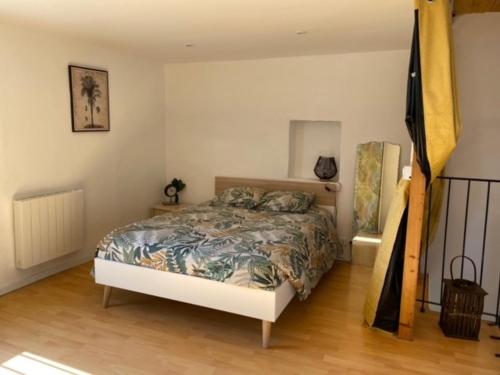 Un pat sau paturi într-o cameră la Le Clos Bellevue