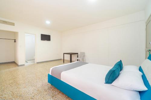 Ayenda Hotel Paraiso Chipichapeにあるベッド