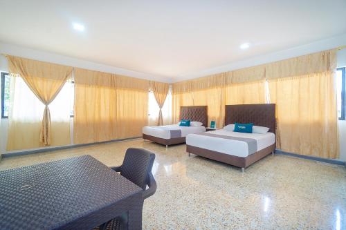 Ayenda Hotel Paraiso Chipichapeにあるベッド