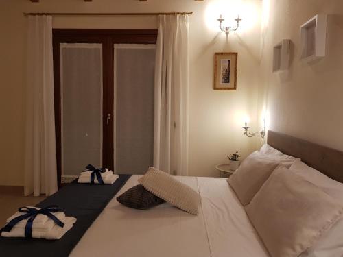 Postel nebo postele na pokoji v ubytování Grace dell'isola dei Coralli
