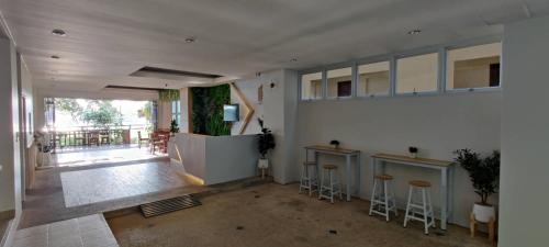a room with a bar with stools in it at Krabi River Hotel in Krabi town