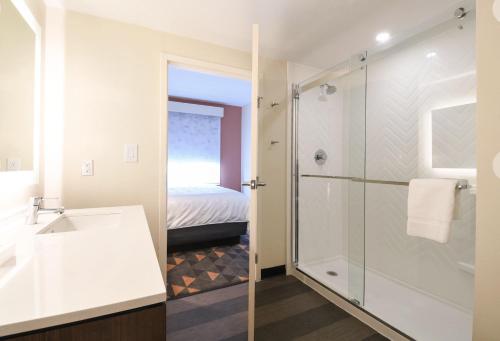 a bathroom with a sink and a shower at Holiday Inn Fredericksburg - Conference Center by IHG in Fredericksburg
