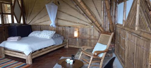 Postel nebo postele na pokoji v ubytování Ecohotel Soplo del Tambo