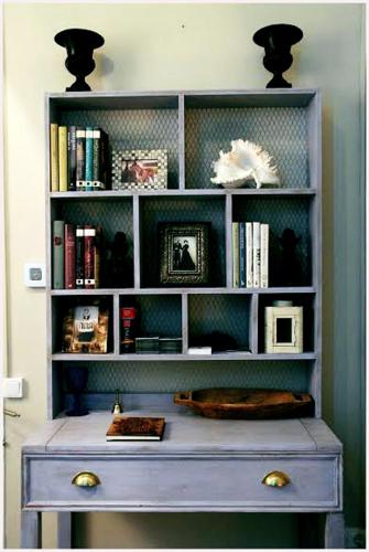 a book shelf with a blue dresser in a room at Casa del Mediterraneo in Barcelona