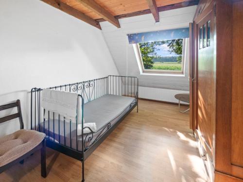 a hospital crib in a room with a window at Unterkunft für Monteure/ Geschäftsreisende bei Familie Bokeloh in Kirchlinteln