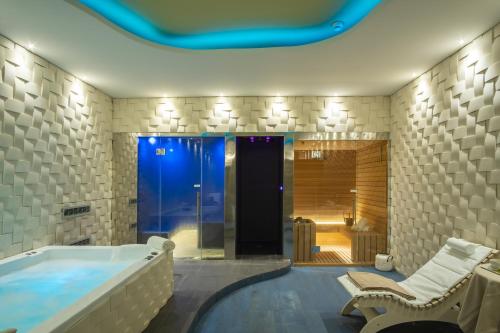a large bathroom with a tub and a shower at Torre Cintola Greenblu Sea Emotions in Monopoli