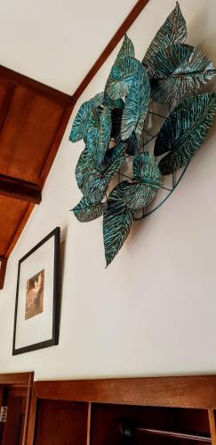 a green plant on a wall in a room at Ombak Resort at Ekas , a luxury surf and kite destination, Close to Inside Ekas beach in Ekas