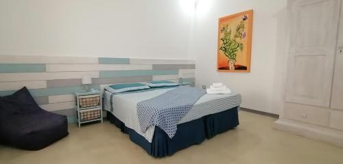 Un pat sau paturi într-o cameră la I Mirti - Home Holiday