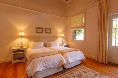 a bedroom with a large bed and a window at Lemoenfontein in Beaufort West