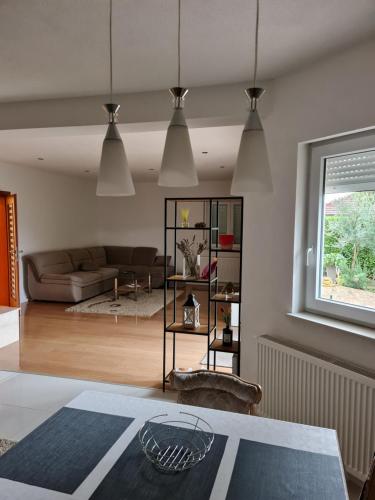 a living room with a couch and a table at Apartman Corluka Grude in Grude