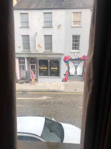 a view from a window of a street with a building at Central Lisburn Duplex Apartment No Parties in Lisburn