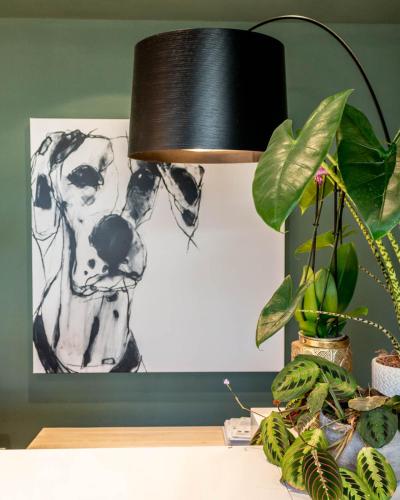 a black lamp on a desk with a picture of a dog at Lu. b&b in Cervia