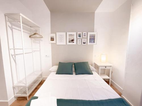 En eller flere senge i et værelse på Pensión Labra
