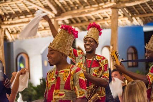 a group of men wearing ice cream cones on their heads at Amani Boutique Hotel - Small Luxury Hotels of the World in Paje