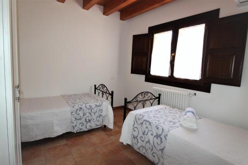 Ένα ή περισσότερα κρεβάτια σε δωμάτιο στο Agriturismo Dispenza