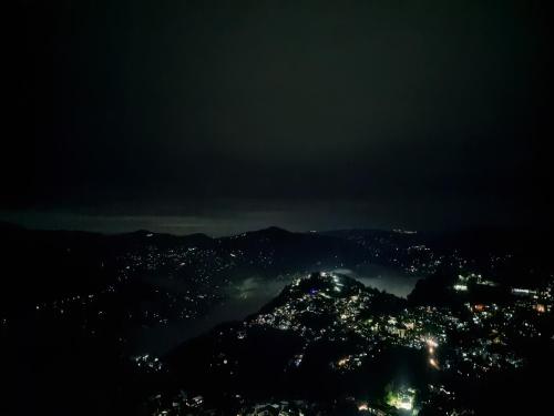 a view of a city at night at Great Eastern Valley Residency in Gangtok