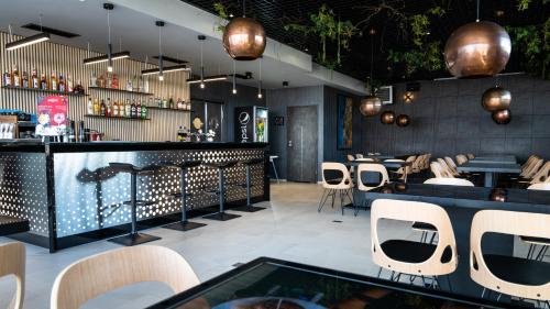 Lounge alebo bar v ubytovaní Za Bunkrem