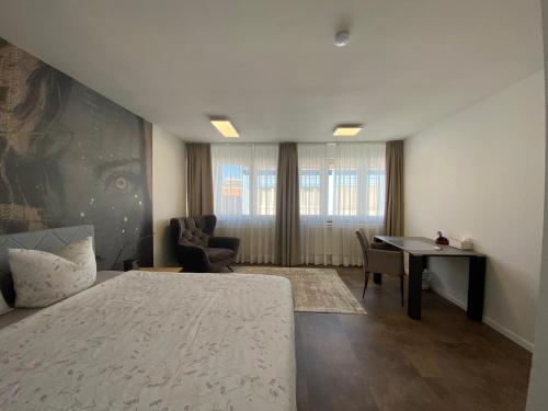 Ένα ή περισσότερα κρεβάτια σε δωμάτιο στο Haus Pia Executive Apartments