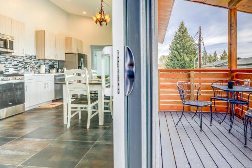 a kitchen with a deck with a table and chairs at Castle in the Sky Unit Z in West Yellowstone