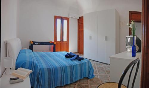 Ένα ή περισσότερα κρεβάτια σε δωμάτιο στο Casa Cipolla