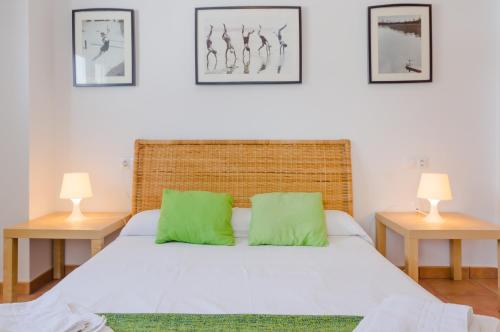 מיטה או מיטות בחדר ב-Apartamentos O2 Conil