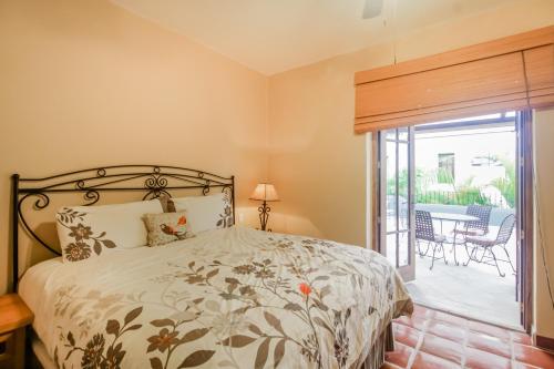 a bedroom with a bed and a sliding glass door at Casa Chica FN320 at Loreto Bay in Loreto