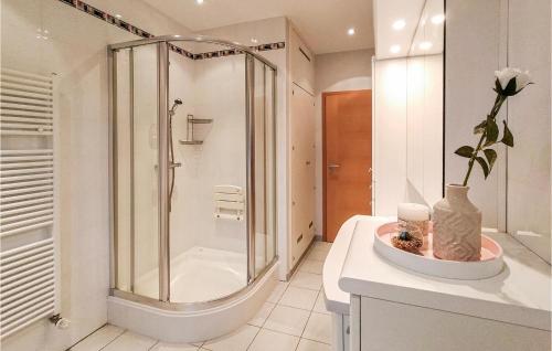 a bathroom with a shower and a toilet and a sink at 2 Bedroom Awesome Apartment In Winseler in Winseler