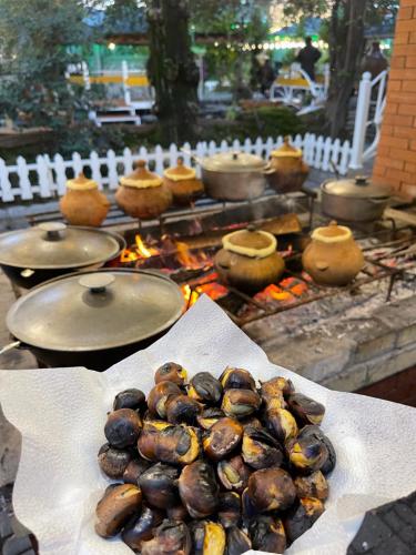 a bunch of food sitting on top of a grill at Qafqaz Fountain Villa in Gabala