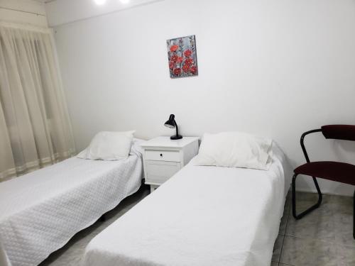 Una cama o camas en una habitación de COLON 66 Departamento Temporario