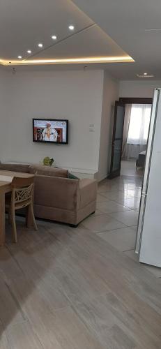 a living room with a couch and a table at FUFA Haute standing appartment S2 center Monastir in Monastir