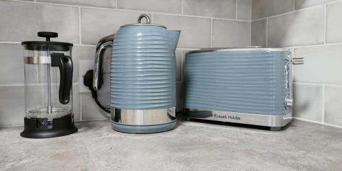 a coffee maker and a blender on a kitchen counter at Crewe Short Lets 1 Victoria Court, Crewe in Crewe