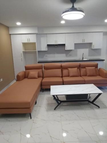 a living room with a couch and a coffee table at Residences Sommet Port Salut in Port-Salut