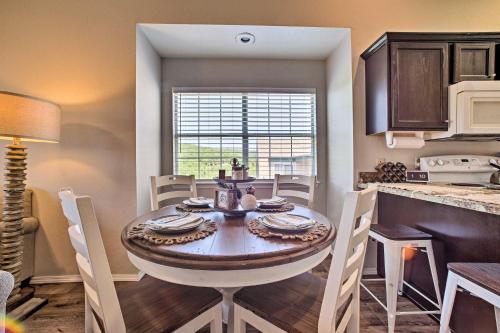 a kitchen and dining room with a table and chairs at The Perch - Cove on Indian Point in Branson